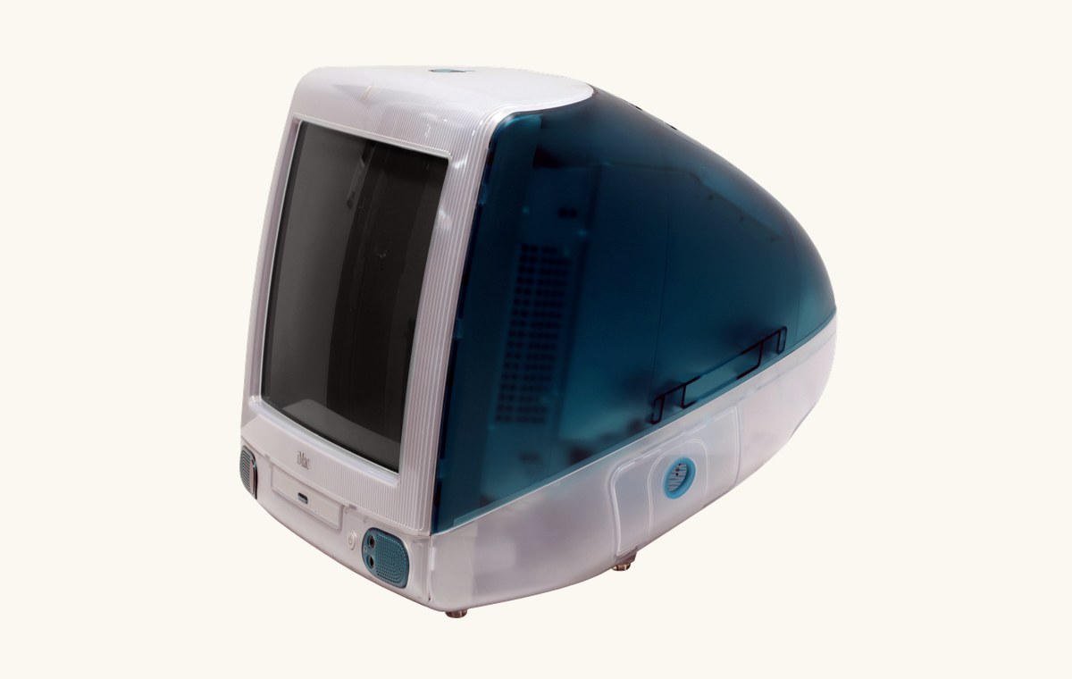 A three-quarter view of a Bondi Blue iMac G3